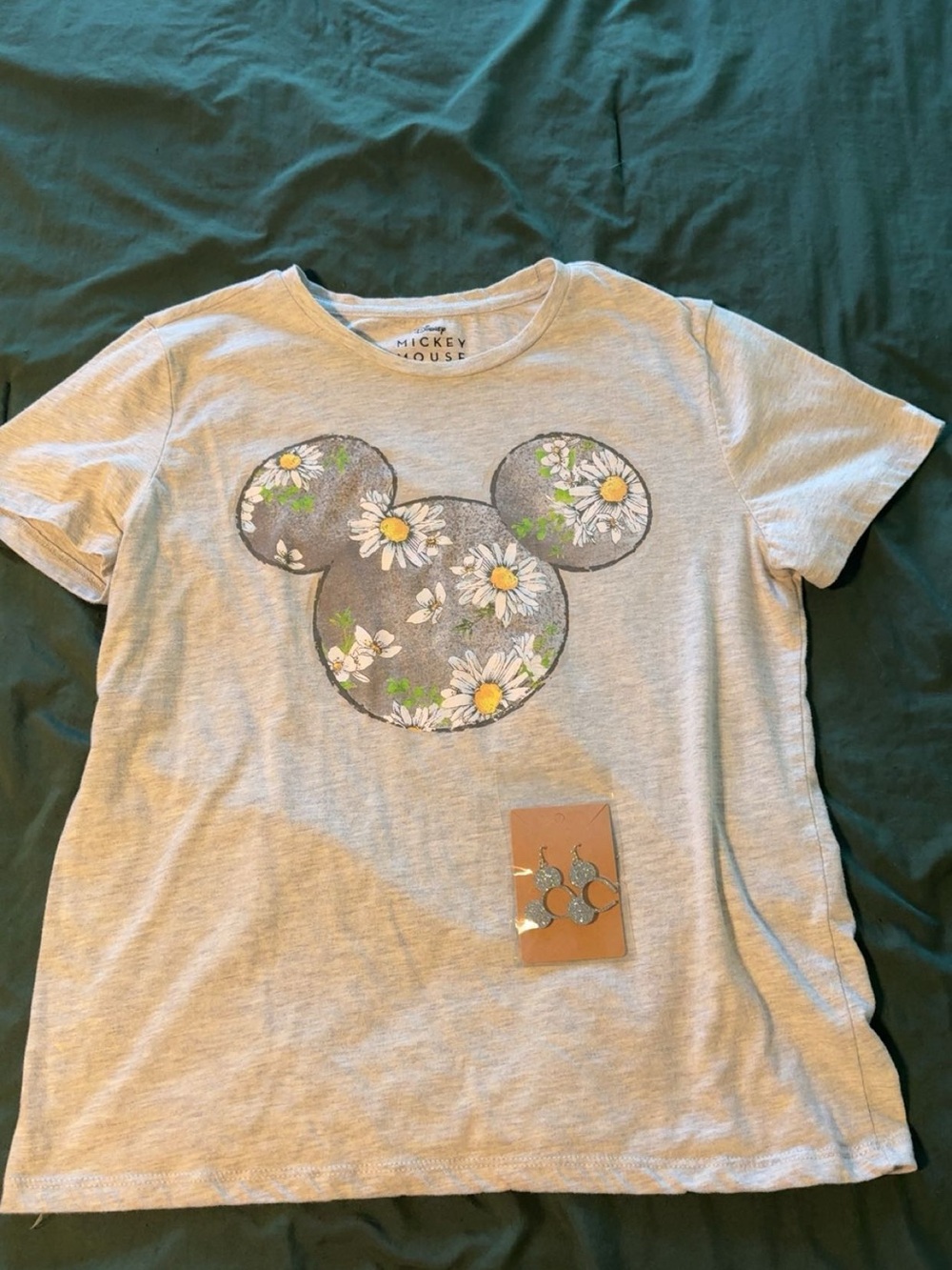Women’s Gray Floral Daisy Disney Top with earrings.